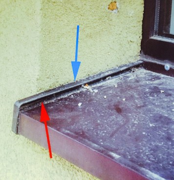 This sill has an end dam. Better, but water can still leak behind it.