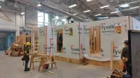 The apprentices practice large-scale projects in an open shop. Not being subject to the weather is a nice change for them. While not quite the same as being on site, working in a controlled environment allows for mistakes (learning opportunities) to happen under supervision. Similar setups to this exist in colleges and union training centers across Canada.
