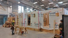 The apprentices practice large-scale projects in an open shop. Not being subject to the weather is a nice change for them. While not quite the same as being on site, working in a controlled environment allows for mistakes (learning opportunities) to happen under supervision. Similar setups to this exist in colleges and union training centers across Canada.