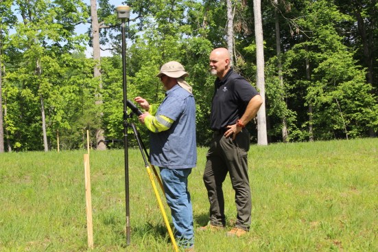 Solar orientation. Todd Usher works with a surveyor to orient the house for optimal solar and to maximize natural daylighting for an upcoming Addison Homes project.