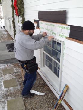 A width of flashing tape secures the drip cap in place.