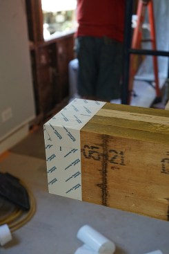 Flush beam. As a measure of added protection. the crew has neatly wrapped the end of the beam that pockets into the exterior wall with a peel-and-stick flashing membrane.