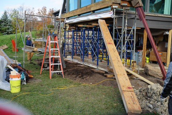 With the rim joist removed, shoring was added to support the floor structure.