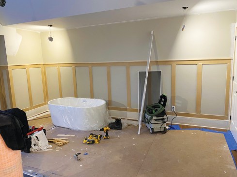A taller but simpler design divides the wall space with applied stiles and rails.