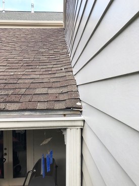 No kickout. This roof-wall intersection should have a kickout flashing to direct runoff into the gutter.