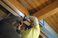 The tapered strips will provide a level surface against which they could place the new steel beam.