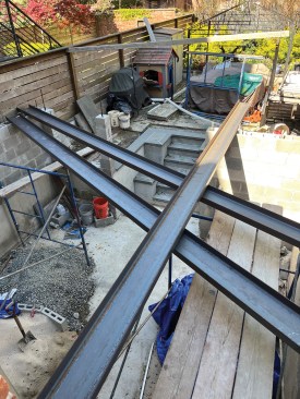 The lengths of C-channel are placed atop the block walls to be fabricated into beams.