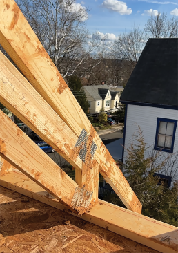 A combination of scissor trusses and stick framing was used to re-create the complex roof geometry that is an important design feature of a Queen Anne Victorian.