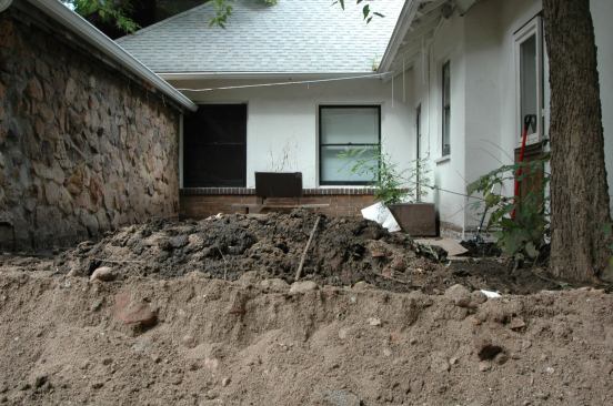 This urban alleyway was deeply filled with sediment, even after a plow went through.