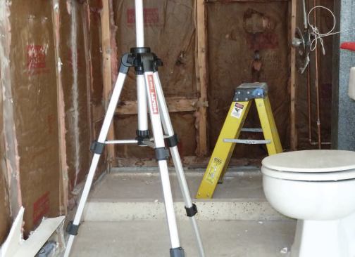 The original shower base had a 3-inch-high curb, common in standard construction but a major obstacle to a wheelchair.