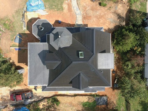 The complex roof plane left little room for conventional photovoltaic panels but worked well for Tesla Solar Roof shingles.