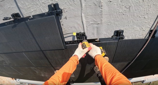 These shingles mimic the look of historical slate shingles. However, the Tesla shingles require a naturally vented roof, which proved challenging with all the hips and valleys that block airflow through many rafter bays.