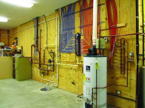 A manifold system is a good way to keep dozens of hot- and cold-water runs organized.