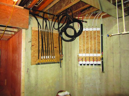 The author recommends organizing outdoor-hose-bibb piping lines and gas lines at a central location.