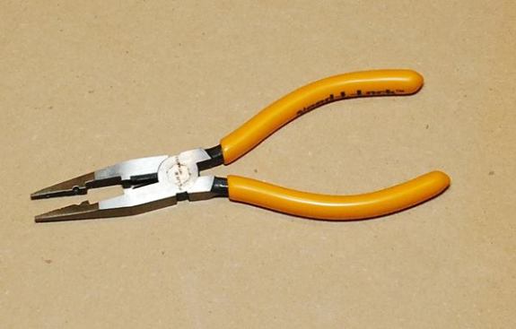Sometimes you got to get in some tight spots and these are great for that but are more than just needle nose pliers. They have a flat area in the middle made for pushing down on gel filled splice caps – which contain conductive silicone gel and are used when you’re in a bind and have to splice a wire. The tool also contains a stripper for 24-gauge wire, the standard gauge of data wire. I use them for twisting wire around binding posts, which are used in phone and AV wiring (if you have some decent stereo equipment there’s probably some kind of binding post behind your receiver). Regular needle nose pliers would work for these applications but for my job specific kits I prefer to have the best tools for the job.
