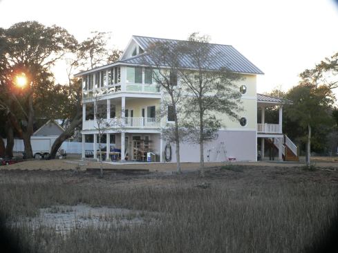 When finished with traditional trim, this coastal home’s porches look like they’re built with wood, but they are drier and more durable and require less maintenance.