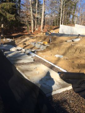 The septic system is in and ready for inspection. Because installing the system meant rendering the site inaccessible for about a week, George is able to complete the work after the framers are delayed.