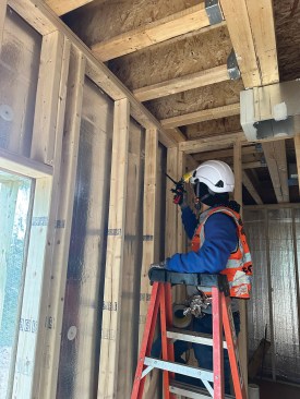Tape, caulk, and foam sealant were used throughout the Queen of Zero home to air-seal it and achieve 1.7 ACH50 at the final blower door test.