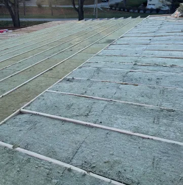 The ladder sections at the edges were framed 24 inches on-center to allow full shear nailing at sheathing edges where uplift and other forces are greater. These cavities were insulated with R-23 stone wool batts.