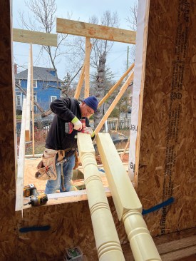 The turned porch posts—another distinctive architectural element—were fabricated by Resin Art and secured with continuous threaded rod from the concrete piers to the roof framing.