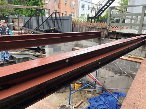 Angle iron to support the corrugated steel decking was bolted to the C-channel.