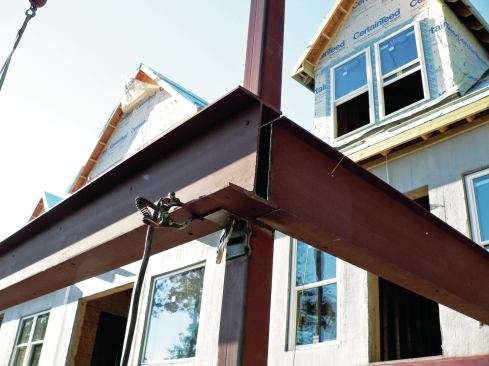 Around the perimeter of the deck, the I-beams that support the panels are welded to 4x4 steel columns.