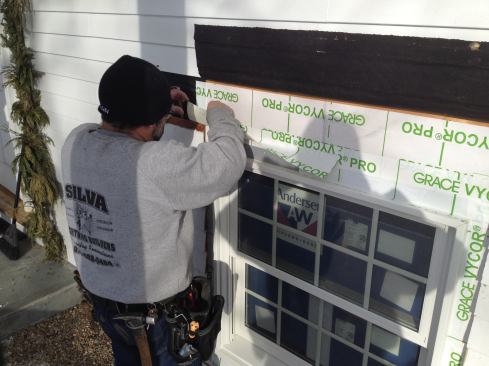 Flashing tape for the top of the window is wide enough to cover the ends of the side flashing.