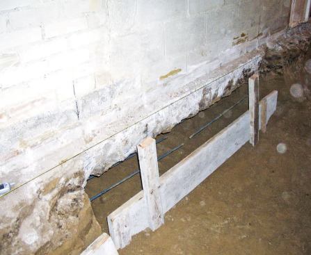 After forming and pouring the corners, we continued the process in alternating 6-foot sections around the perimeter, placing the rebar so that it extended past the ends of the forms.