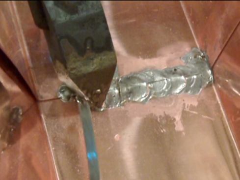 Each drop adds another layer, and the heat of the iron on the copper draws the solder into the seam to make a water-tight seal. Slowly walk the soldering iron across the surface of the seam, building up the solder as you go; adding flux as needed. I like to get a nice buildup of solder.