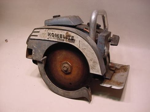 From the blade side, the XL-100 resembles the conventional circular saws of its day. The gas tank and front handle are the only give-aways that it's somehow different. This is what the saw looked like before Tony restored it. To give you a sense of how rare these things are, when he bought the saw on eBay he was bidding against 15 other people and had to pay about $600 to get it.
