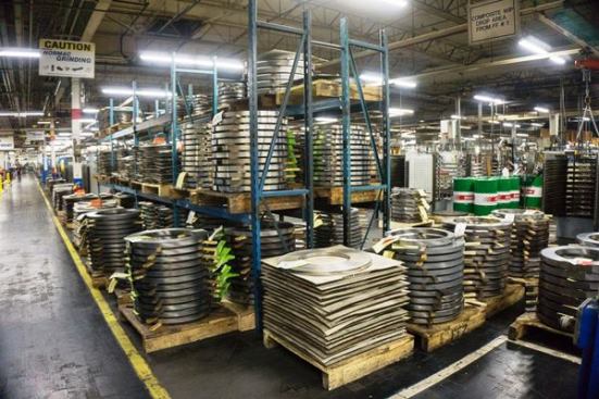 The sides or blade of a Speed Slot Hole Saw are made from bimetal material, a narrow strip of HSS (high-speed steel) edge-wire welded to a wider high carbon steel backer. The teeth are cut into the HSS, which is hard and resists wear better than high carbon steel. These are rolls of the carbon steel backing material before it’s attached to the HSS. It’s mind blowing to see how many towers of steel coil are stacked around the factory.