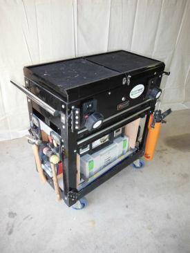 I use a Homak 27" Pro Series 2 drawer slide top cart. I chose it for its size; it needed to fit in a specific place on the truck and be light enough to load and unload myself. I knew whatever cart I purchased, I would be tricking it out to fit my needs. This particular cart is lighter duty than I would like, so I added a solid base in the lower shelf and changed out the casters to blue polyurethane full-swivel wheels suitable for use in hospital environments. They are quiet, non-marring, and more resistant to picking up grease than hard plastic wheels.