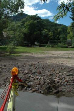 Formerly lush green lawns were buried with sandy soil and strewn with rocks washed out of nearby creek beds.