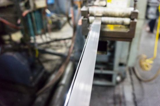 Here you can see the edge-wire and backer lined up before they enter the electron beam welding machine.