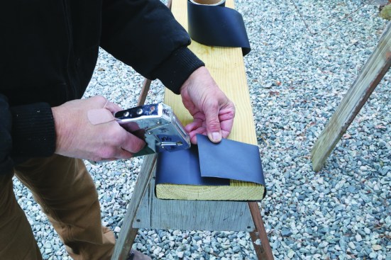 A staple-on isolation membrane or a self-adhering membrane is applied to joist ends and ledgers.