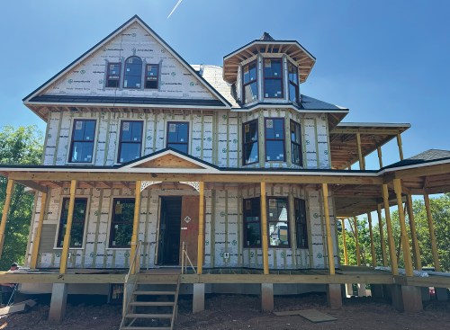 As the building is enclosed, its Queen Anne persona begins to take shape.