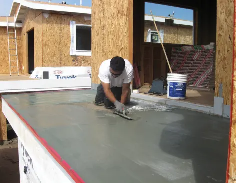 A multilayer cementitious coating provides a walkable waterproof surface with a Class A fire rating.