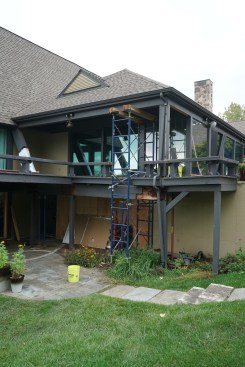 To complete demolition of the old deck, additional shoring was erected to the left and right of the A-frame gable end. This shoring supported the roof extending over the deck on each side.