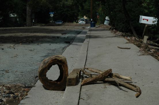 Lines of wooden flotsam mark what had been the edge of the floodwaters.