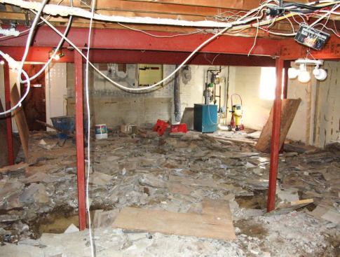 To minimize the need for supporting columns and bearing walls, we planned to support as much of the first-floor system as we could with new steel beams.
