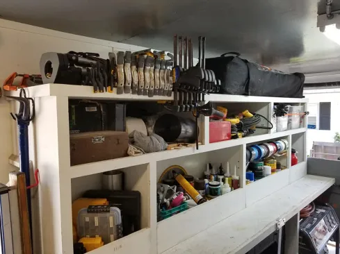 Did I mention I can see everything? I know when stuff is missing or needs to be put back. Also, the trailer is plumbed for air and wired for shore or battery power so when I plug the trailer in, everything inside—chargers, tools, etc—is energized all at once. The extra 6-inches of ceiling height pays off just in clamp storage and clearance under the LED lights.
