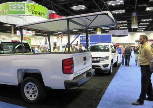 BrandFX makes composite truck bodies and this BFX Easy Lift, a tonneau cover that pivots up on a pair of arms with gas cylinder assists. When open, it provides shade for anyone standing behind the tailgate. When closed it provides security. If you need to haul a load that won’t fit under it when closed, you can drive with it open at up to 75 mph. The cover weighs about 180 pounds and sells for about $2,600.
Click here for video of it being operated.