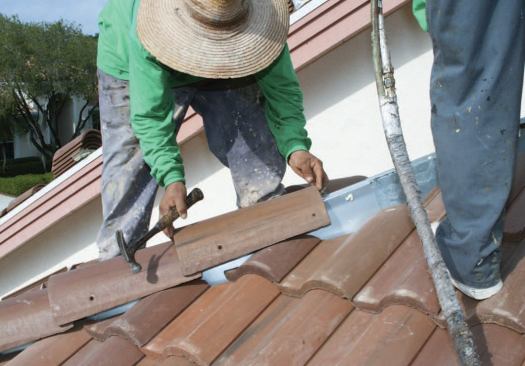The tile is set gently in place on the channel.
