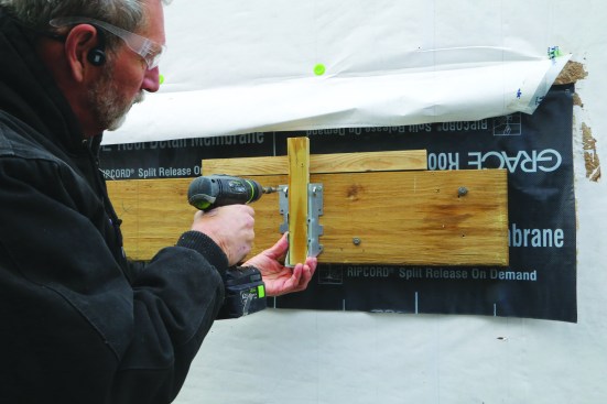 The author prefers to install joist hangers prior to hanging joists, using a site-built T-jig to quickly and accurately place the hangers. When using this method, be sure that the joists are uniformly sized.
