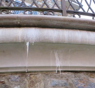 Efflorescence—white mineral deposits leaching out of stone and concrete—is a clear sign of moisture moving through masonry, and its presence is helpful for identifying where a waterproofing layer has failed.