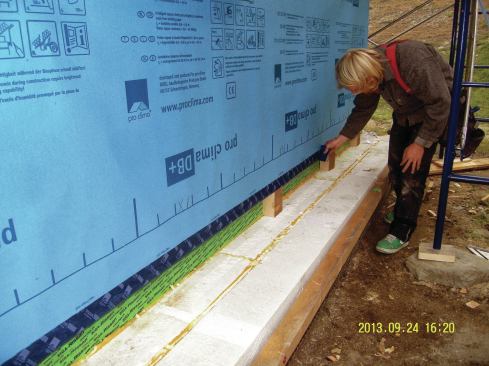 The top of the foundation wall is rarely flat enough for generic sill seal to fill the gap between the concrete and band joist, resulting in serious air leaks as well. In this Passive House, though, that connection wasn’t an issue. 