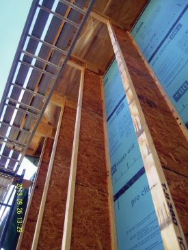 The insulation curtain wall consisted of 16-inch vertical wood I-joists spaced 36 inches on-center filled with dense-pack cellulose. 