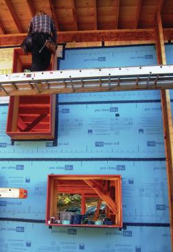 The 3/4-inch plywood window bucks were set in place before the building was wrapped with DB+.