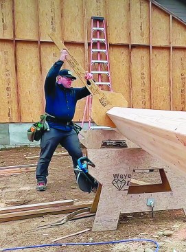 This simple moment arm gives the author enough leverage to tip the beam on edge safely and quickly.