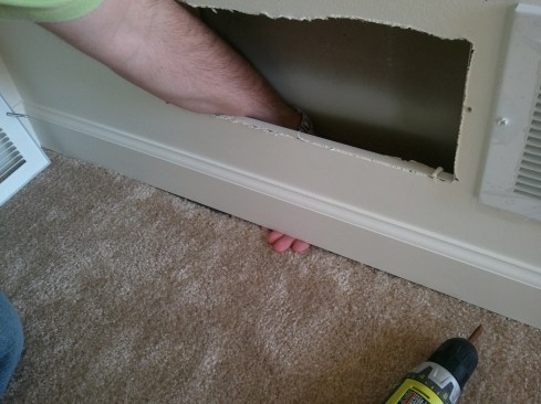 After carpet and trim are in place, a huge air gap remains at the base of the wall, communicating with the cold vented attic.